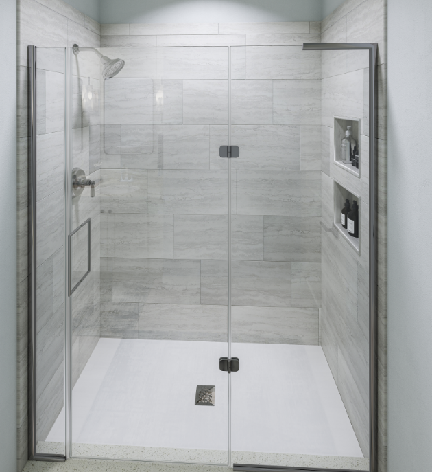 Luxury apartment bathroom with walk-in shower that has a glass door and nooks in the wall for storage