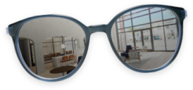 a pair of sunglasses with the leasing office reflection in the lenses on a transparent background